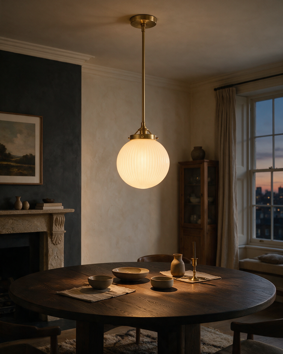 Pendant light switched on above a dining table