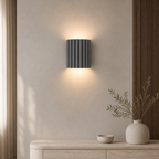 Grey ArtiGlow ribbed wall light in a warm contemporary interior